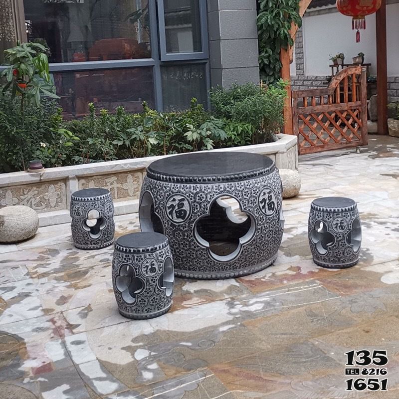 石桌雕塑-家用庭院摆放大理石黑镂空圆鼓休闲石桌石凳高清图片
