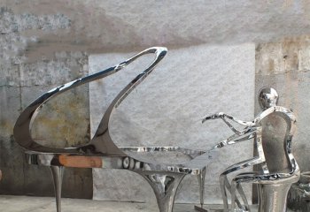 钢琴雕塑-景区一位弹钢琴的不锈钢镜面抽象钢琴雕塑