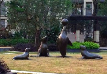 海豹雕塑-草坪上摆放的贪玩的玻璃钢喷漆海豹雕塑
