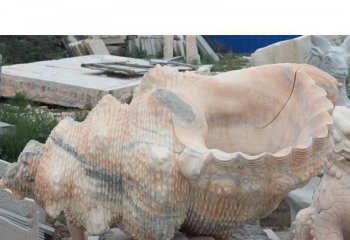 海螺雕塑-花池边摆放的花岗岩石雕创意海螺雕塑