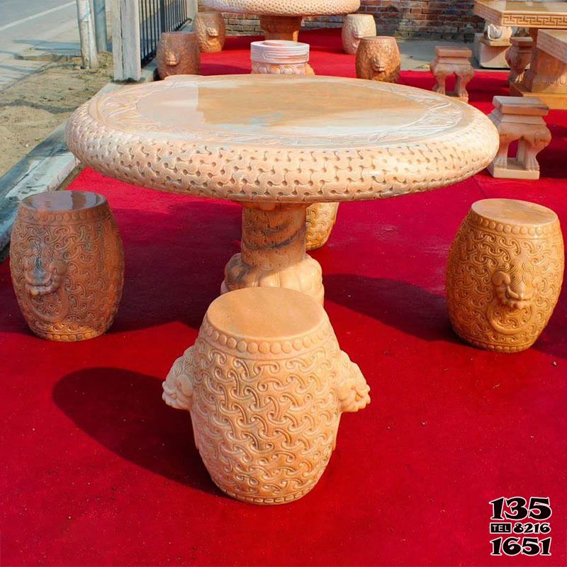 石桌雕塑-晚霞红浮雕圆桌别墅庭院摆放休闲石桌圆凳高清图片