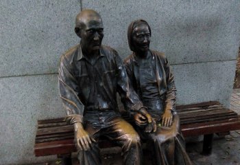 座椅雕塑-步行街坐在椅子上的老年夫妻小品铜雕