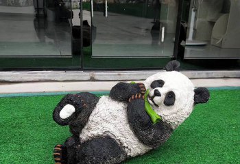 熊猫雕塑-学校商店门口摆放的彩绘躺下玩玻璃钢熊猫雕塑