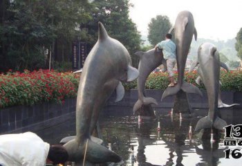 海豚雕塑-池塘中跳跃着四只大号不锈钢海豚雕塑