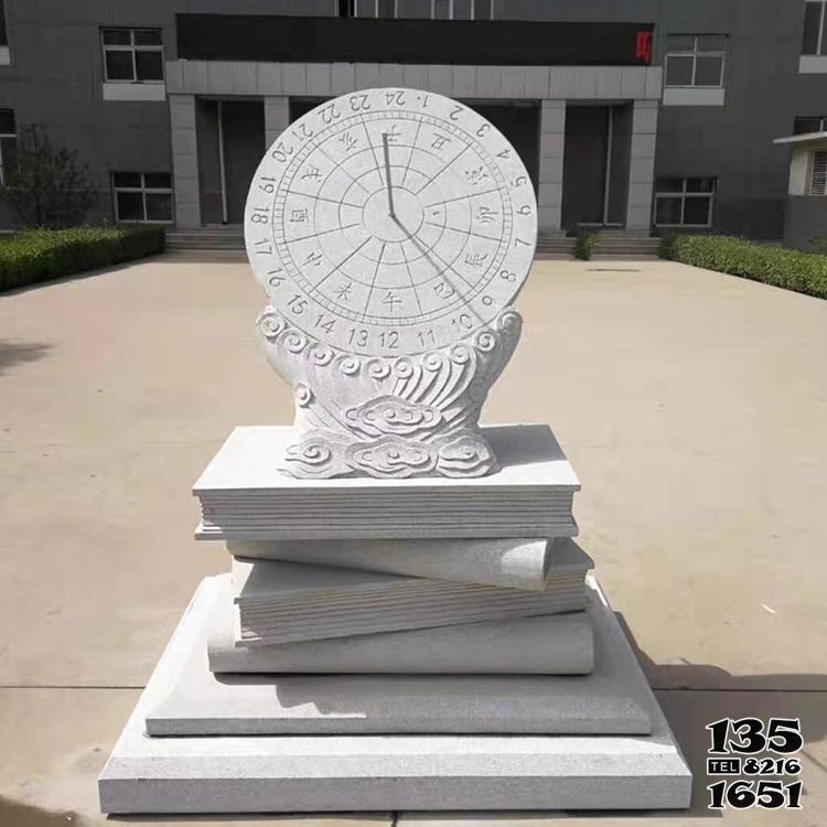 日晷雕塑-校园汉白玉浮雕书本上的日晷雕塑高清图片