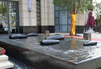 鹅卵石雕塑-酒店池塘创意抽象水中的鹅卵石雕塑
