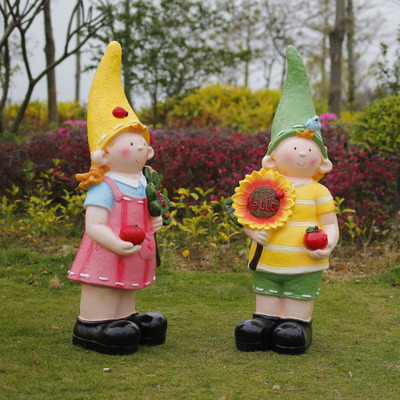 花园娃娃雕塑-户外草坪玻璃钢彩绘公园装饰品景观向日葵花园娃娃雕塑高清图片