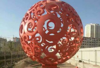 镂空球雕塑-公园不锈钢喷泉中的红色镂空球雕塑