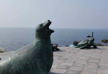 海豹雕塑-广场摆放的仰天长啸的青石石雕创意海豹雕塑