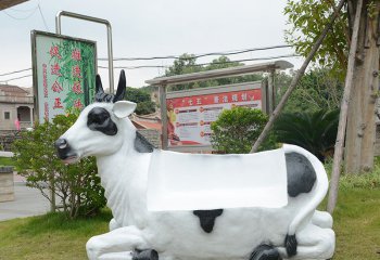 牛雕塑-商场中一只仿真奶牛座椅玻璃钢牛雕塑