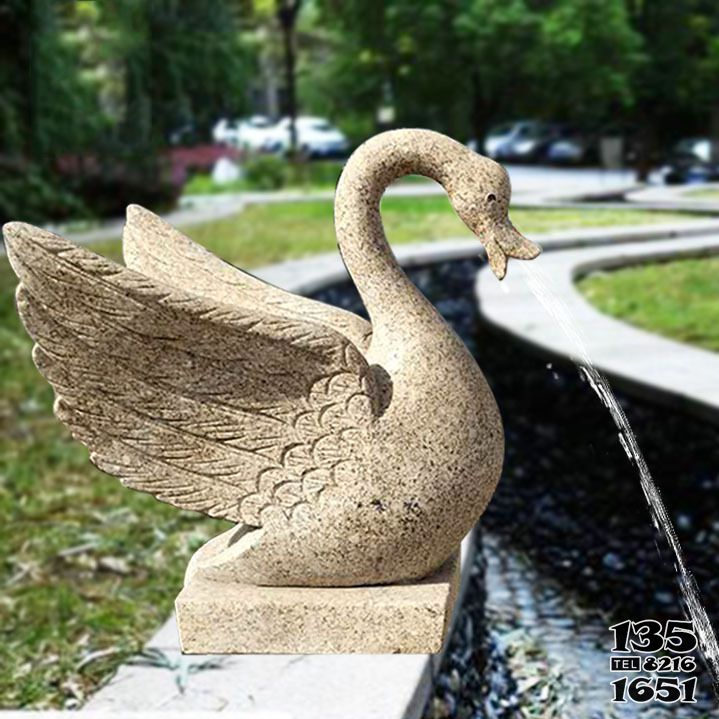 天鹅雕塑-湖边大理石切面喷水展翅天鹅雕塑高清图片