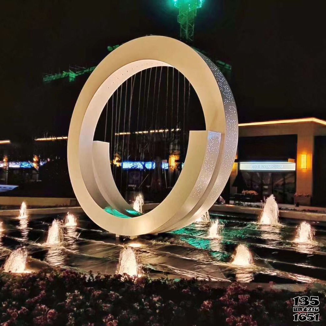 喷泉雕塑-创意环状景观雕塑不锈钢灯光喷泉高清图片