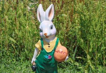 兔子雕塑-广场一只抱球男兔树脂彩绘兔子雕塑
