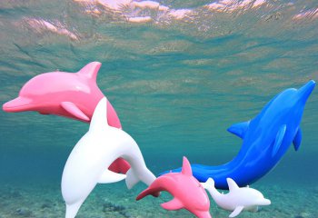 海豚雕塑-水中游着几只色彩斑斓的不锈钢海豚雕塑