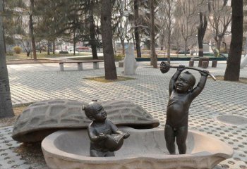 荷花雕塑-手拿莲蓬和石榴的小孩铜雕在花生壳里的荷花雕塑