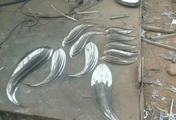 鱼雕塑-池塘一群不锈钢镜面游来游去的鱼雕塑